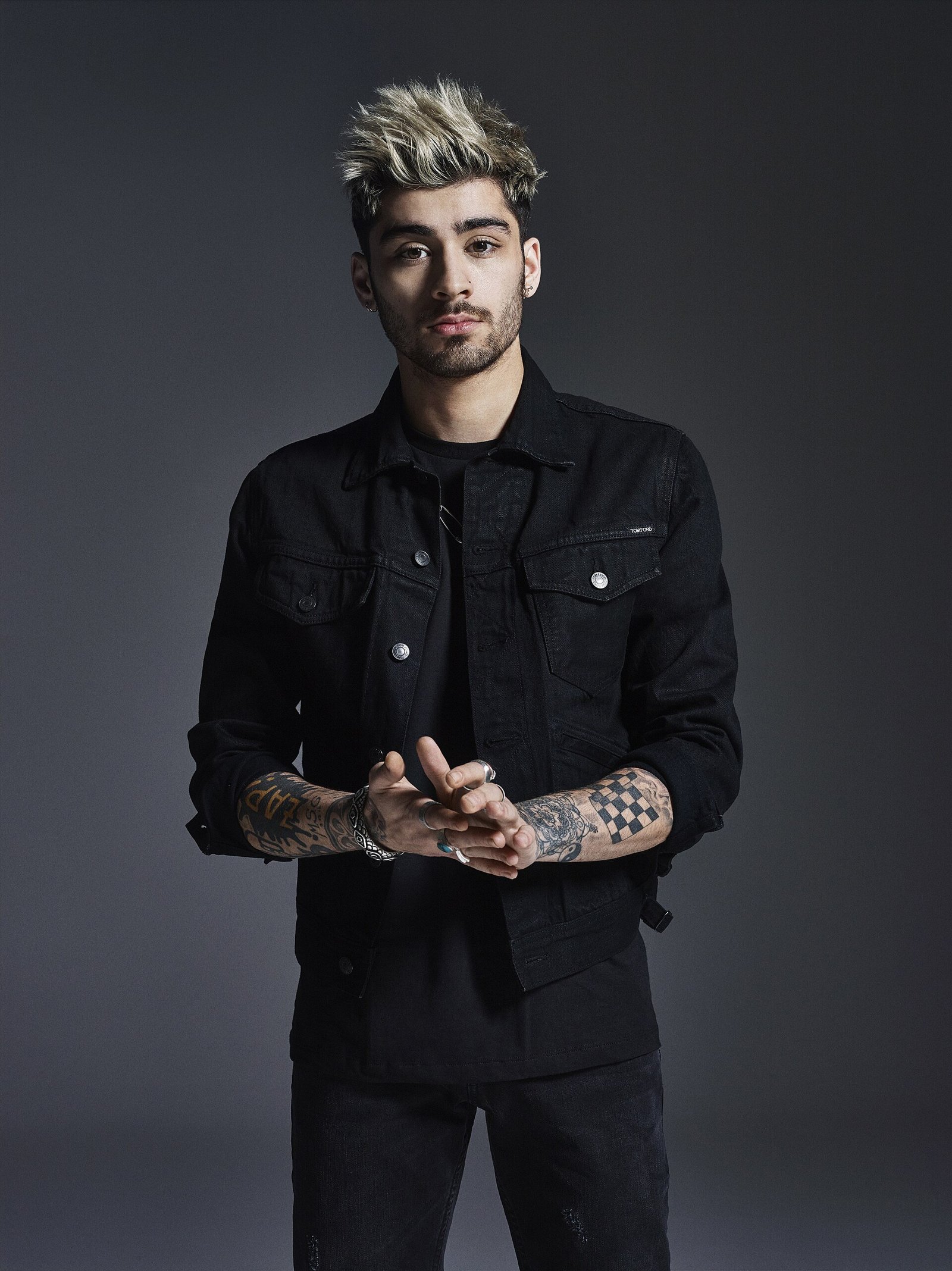 Portrait of British singer ZAYN in a black jacket