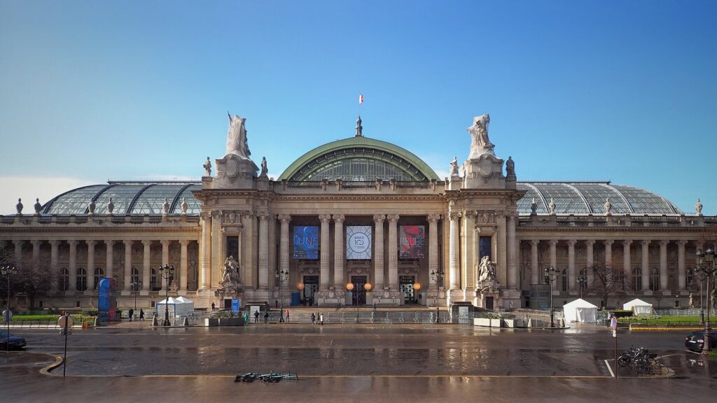 The Grand Palais in Paris with its glass roof under a blue sky