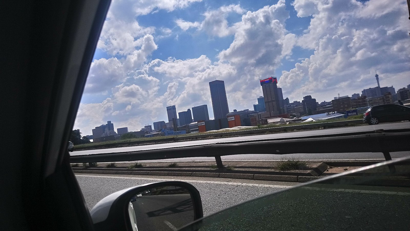 The Johannesburg city skyline under a blue sky
