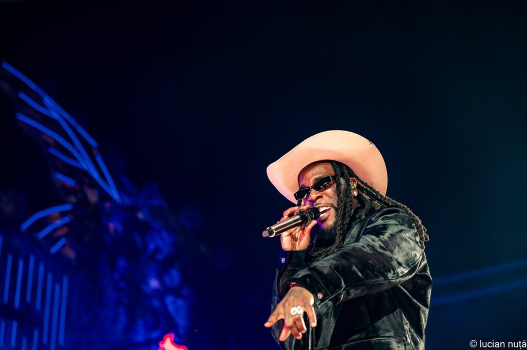 Burna Boy performing on a festival stage