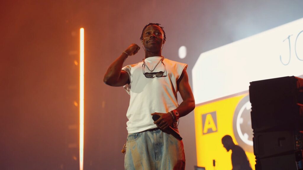 Asake performing on stage at a concert in Toronto
