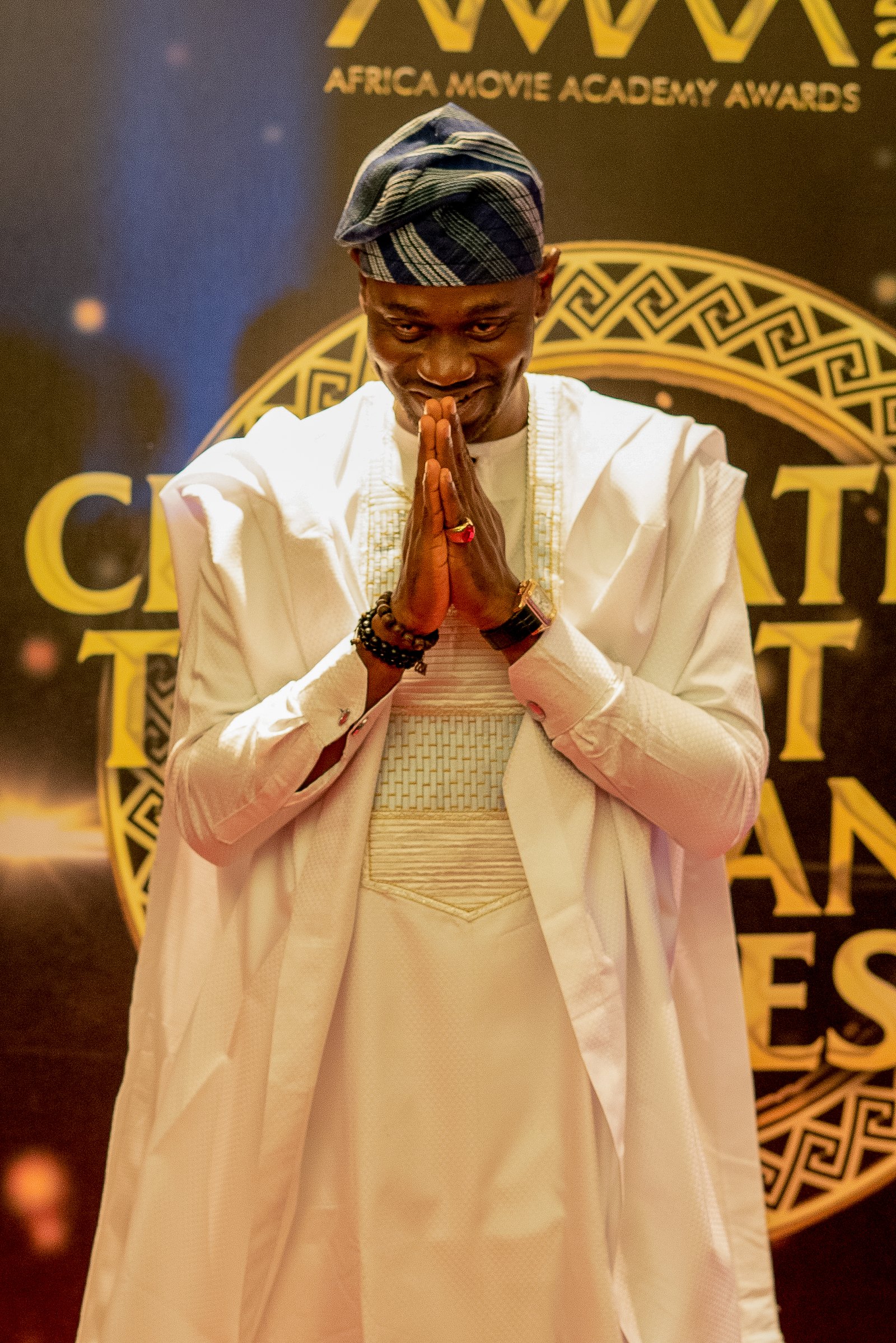 Lateef Adedimeji in white agbada at the Africa Movie Academy Awards
