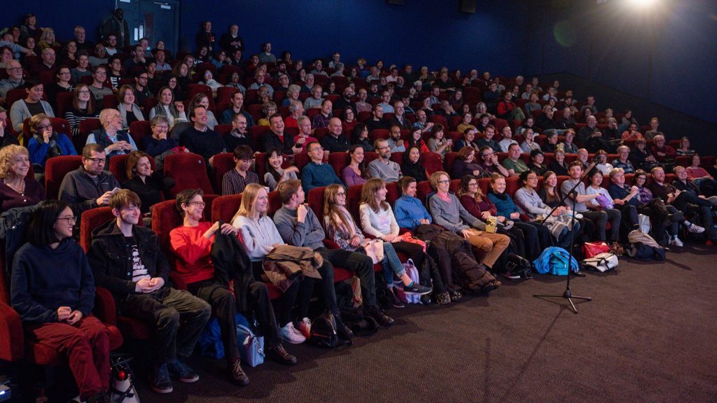 Full cinema auditorium before a film festival screening