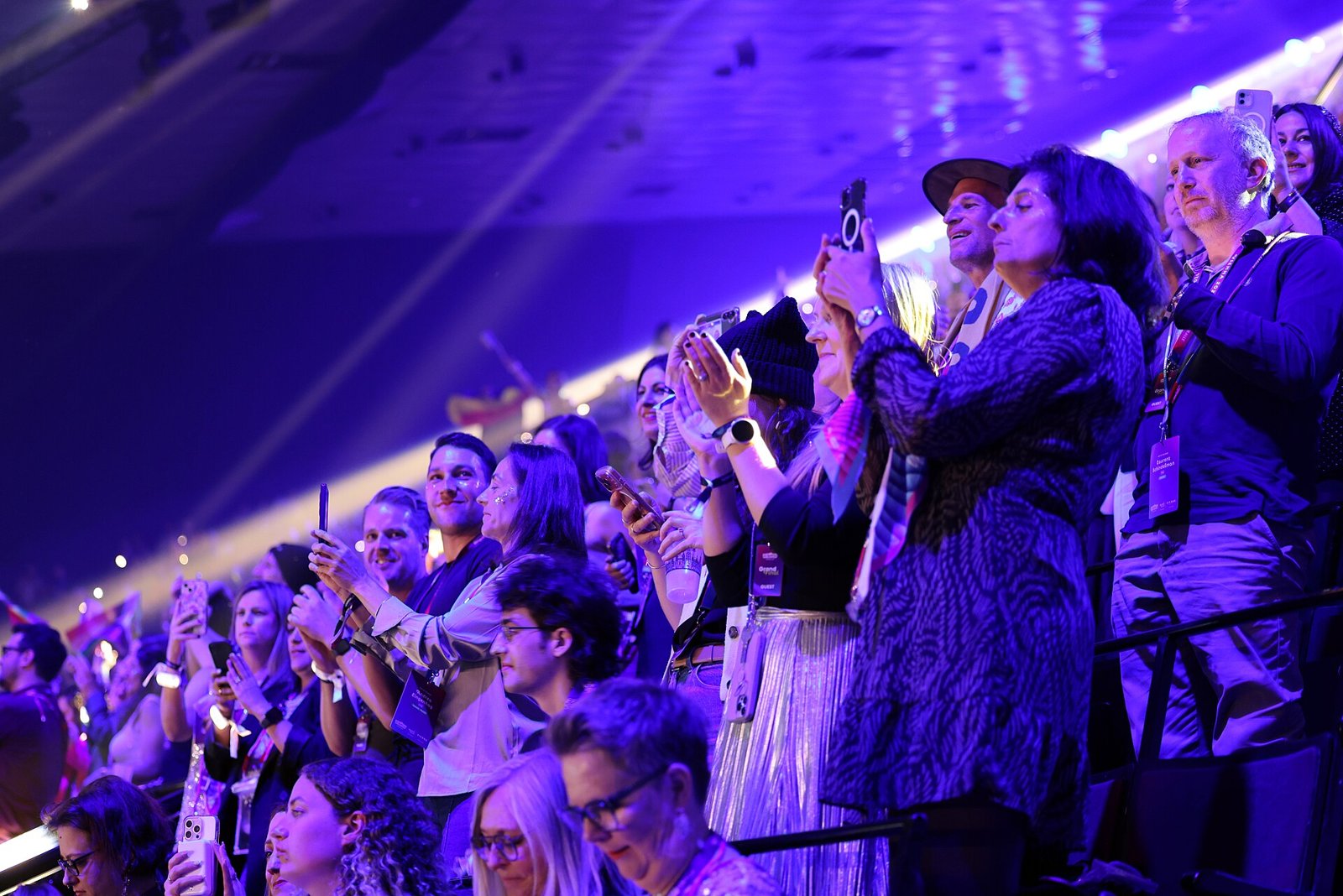 Fans waving flags in the audience at the Eurovision Song Contest 2026 in Vienna